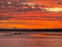 a sunset over a body of water